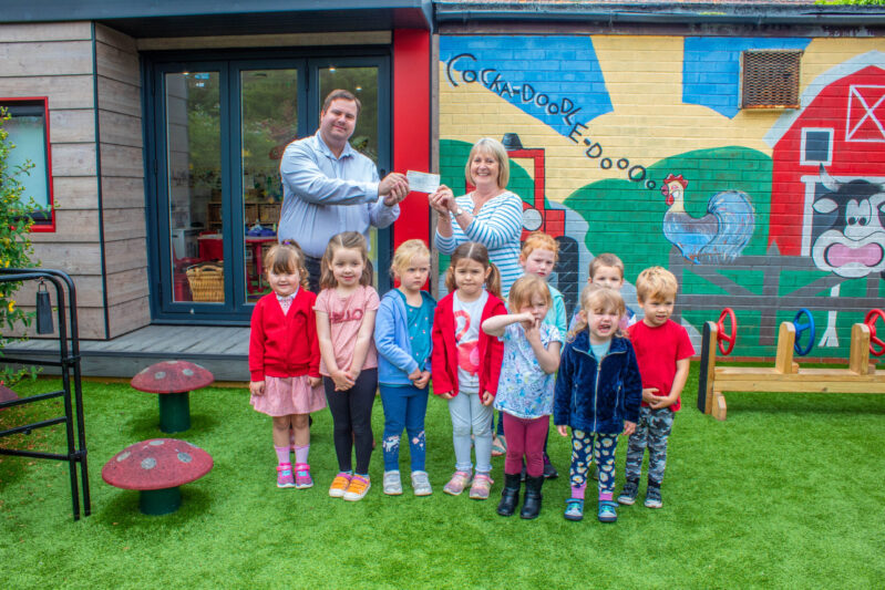 Left: Cullen MacIntosh, Pavers and Pip Mountain, First Steps Pre-School manager with the children of First Steps Pre-School